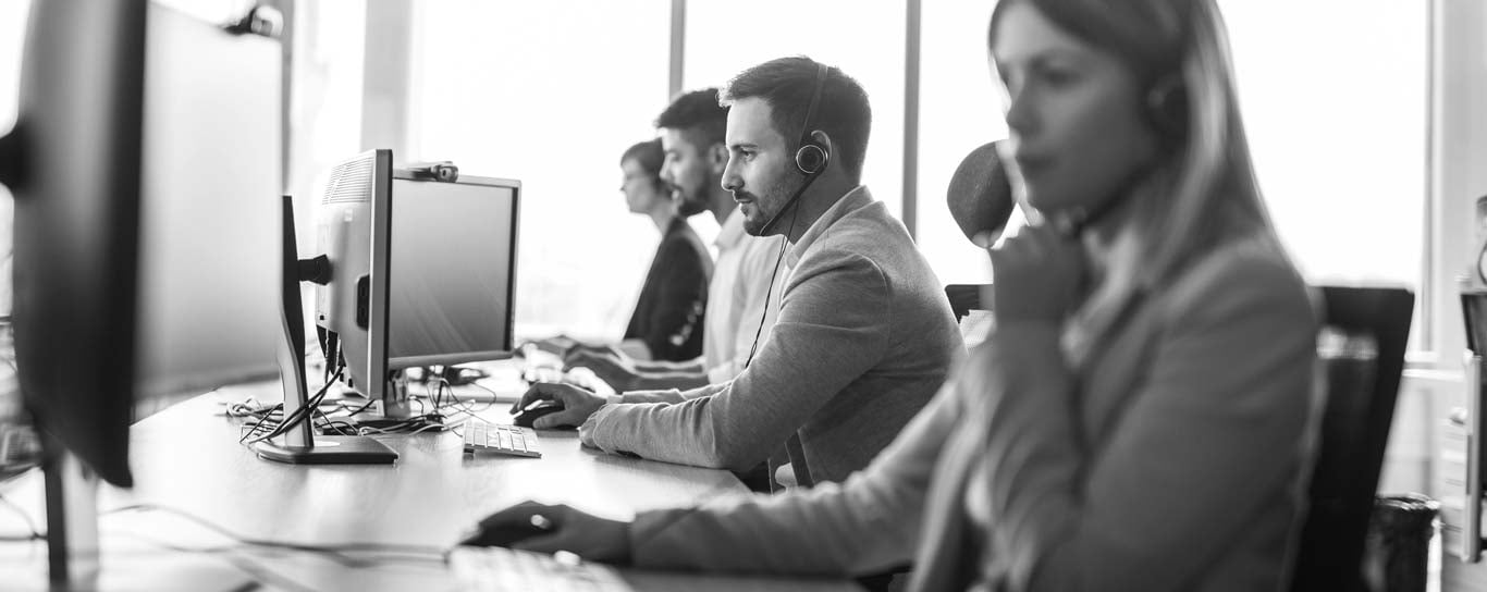 Workers in office working on computer